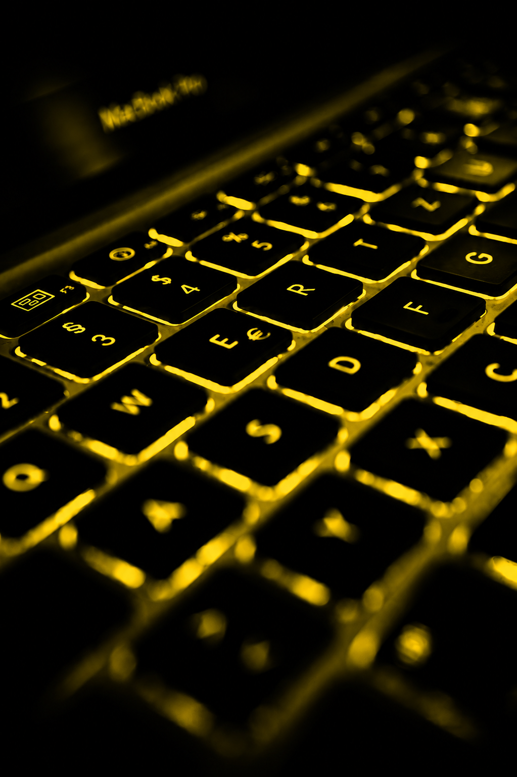 Backlit keyboard representing coding and robotics education